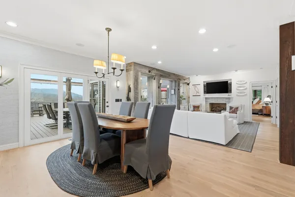 a spacious bedroom with a bed and a chair