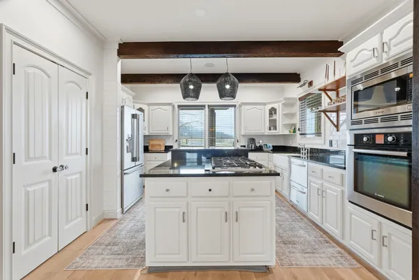 a bathroom with a bathtub and shower