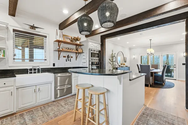 a bedroom with furniture and a chandelier