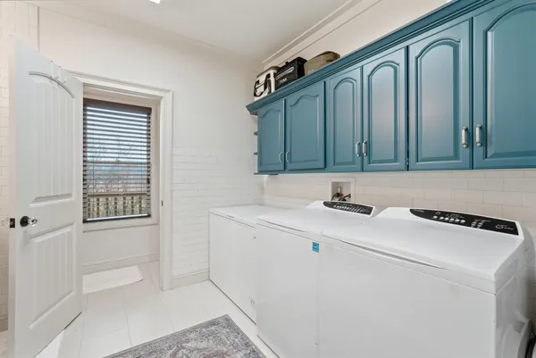 a view of a balcony with wooden floor and lake view