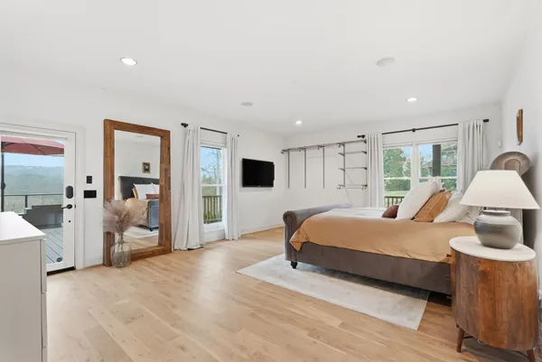 a view of a house with pool and chairs