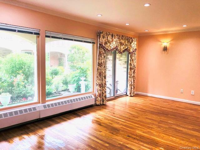 12-31 Robin Lane, Unit TRIPLEX Queens, NY 11360 - Photo 5 of 17 a view of a room with wooden floor and window