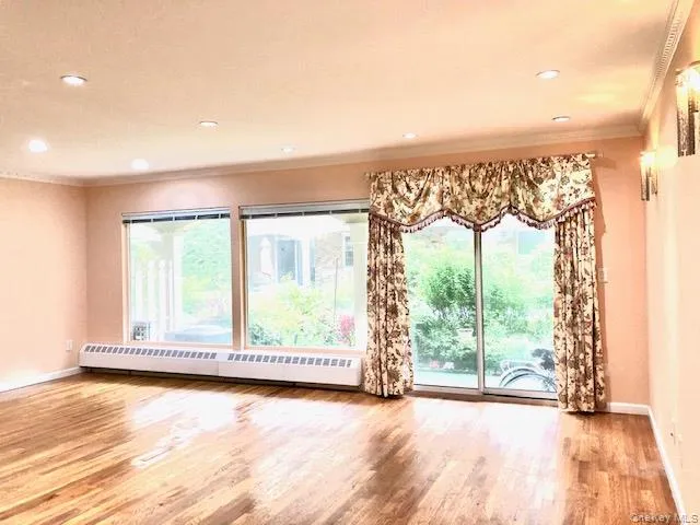 a view of a room with wooden floor and walls