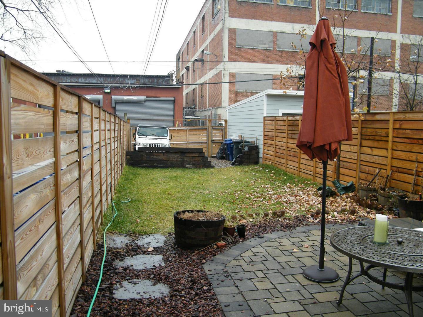 756 Morton Street Northwest Washington, DC 20010 - Photo 11 of 13 a backyard of a house with yard and outdoor seating