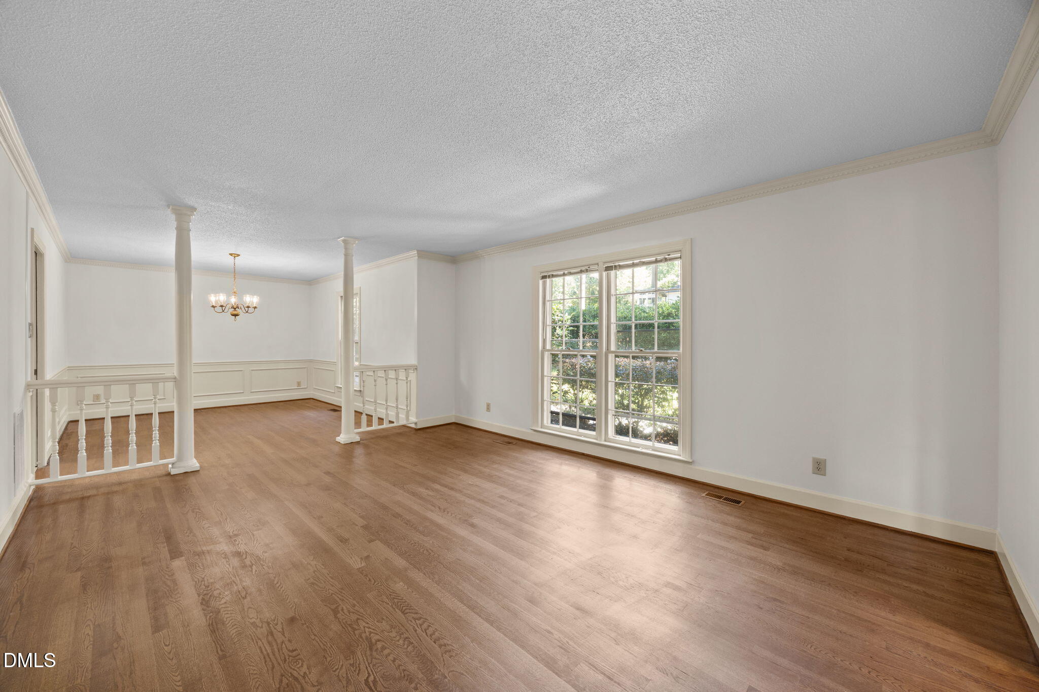 8701 Oneal Road Raleigh, NC 27613 - Photo 4 of 33 Beautiful hardwood floors highlight the living room and dining room