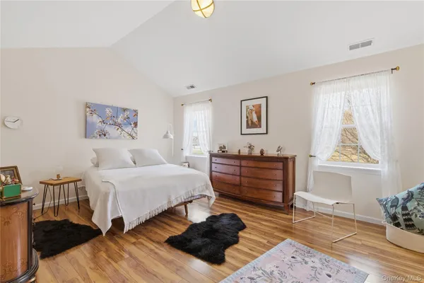 a bed room with a bed and a window