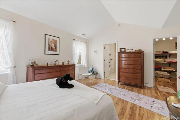 a bedroom with a bed and furniture