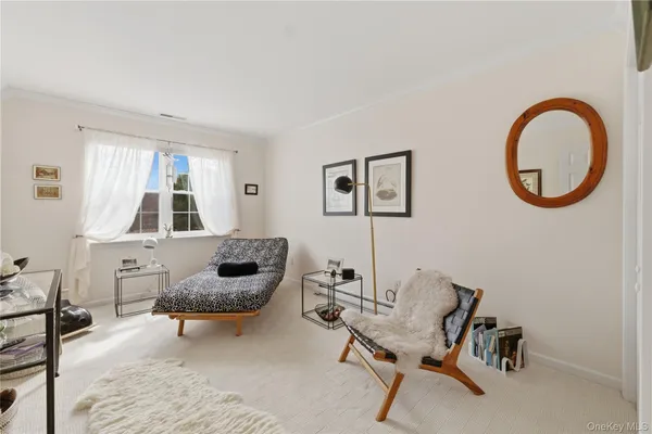 a living room with furniture and window