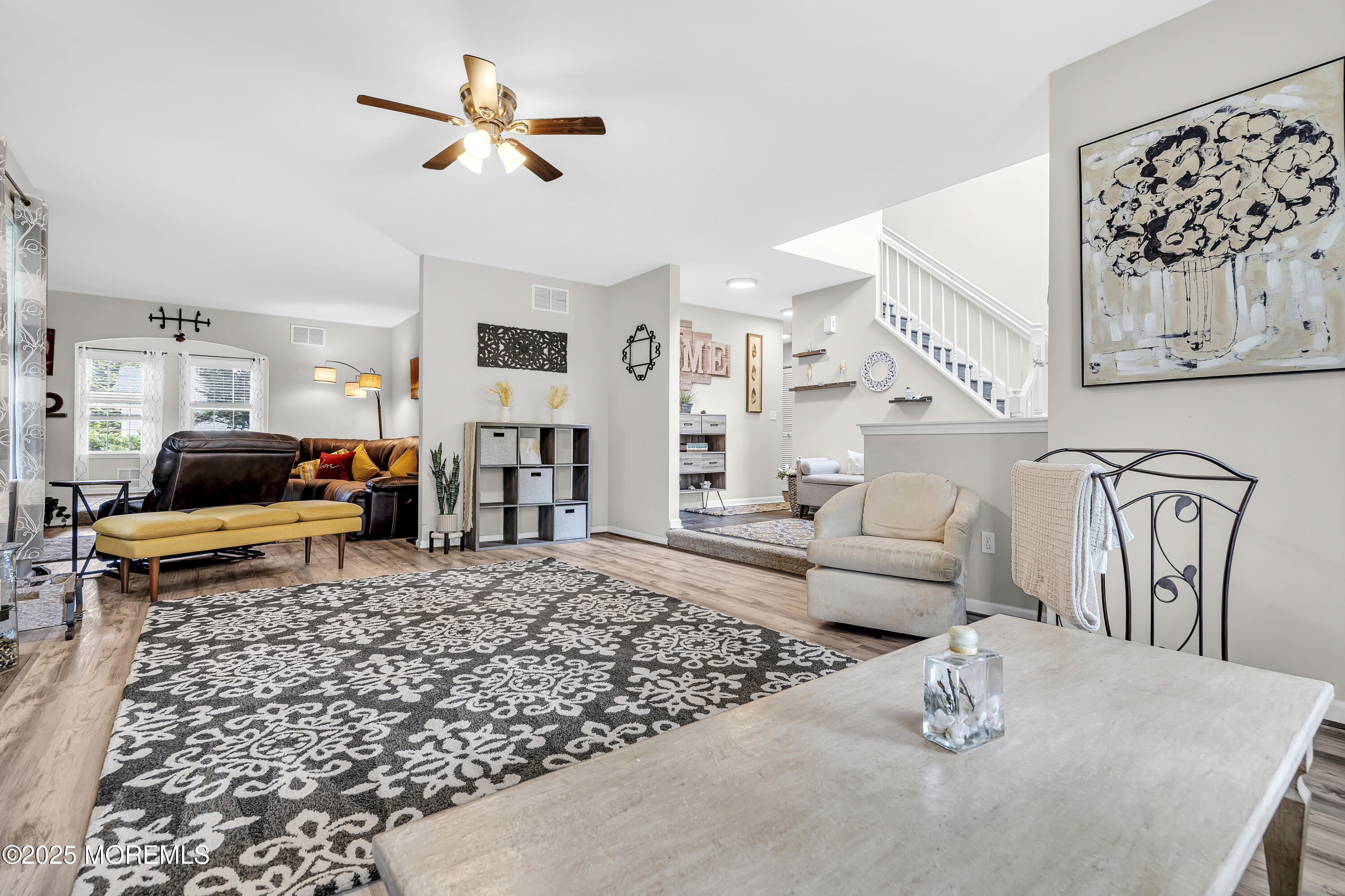 167 Captain Road Manahawkin, NJ 08050 - Photo 11 of 86 a living room with furniture and a table