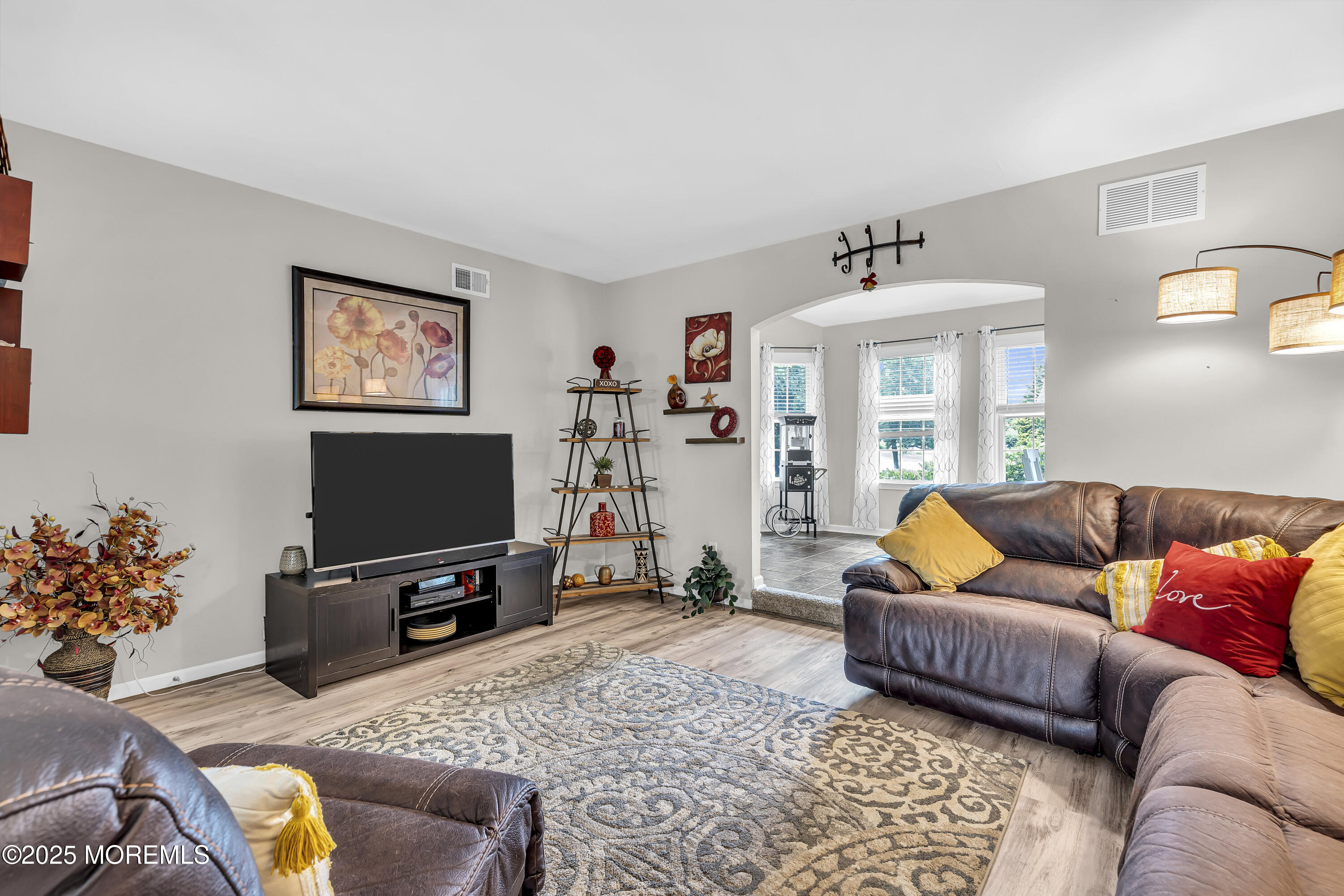 167 Captain Road Manahawkin, NJ 08050 - Photo 16 of 86 a living room with furniture and a flat screen tv