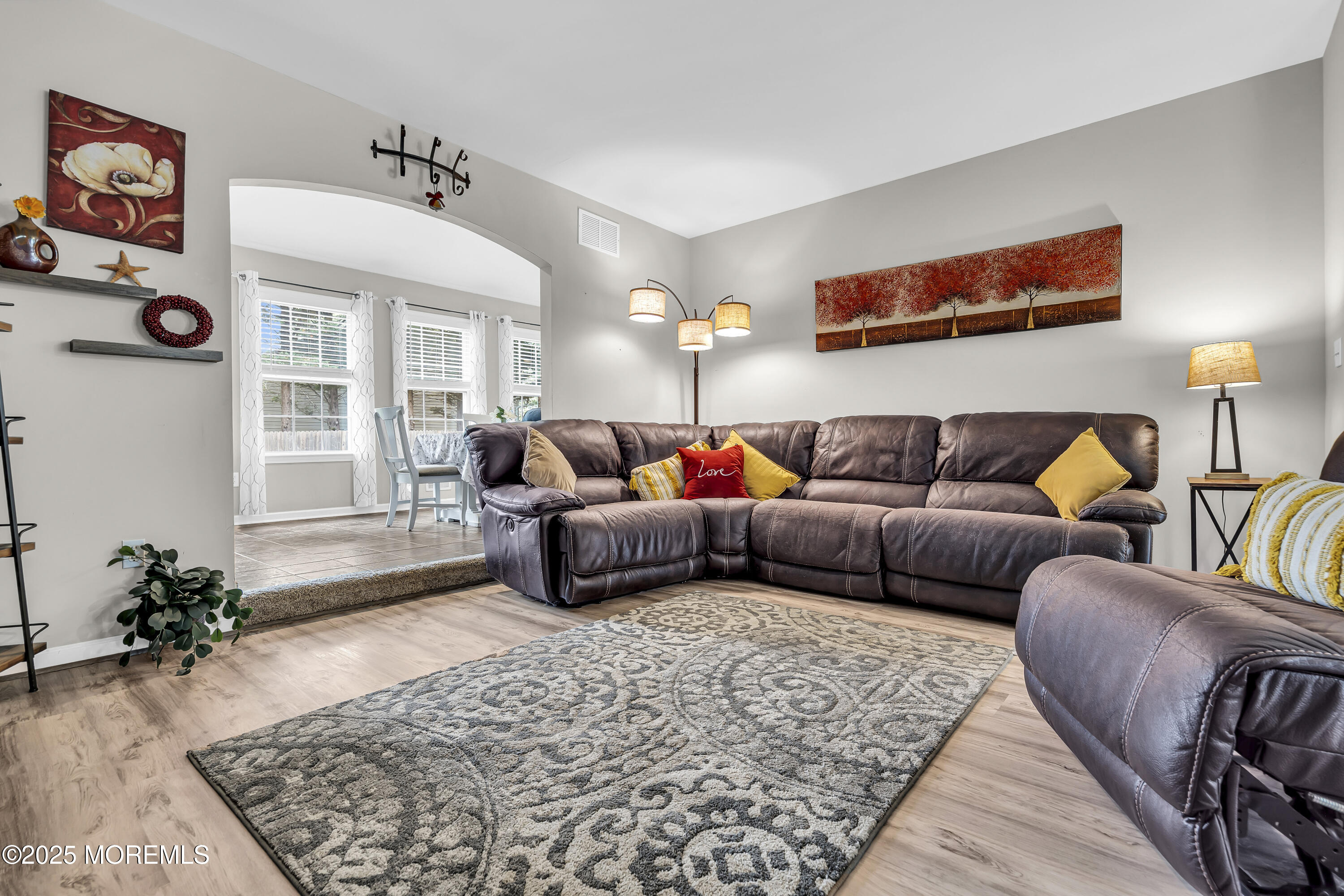 167 Captain Road Manahawkin, NJ 08050 - Photo 18 of 86 a living room with furniture ceiling fan and a rug