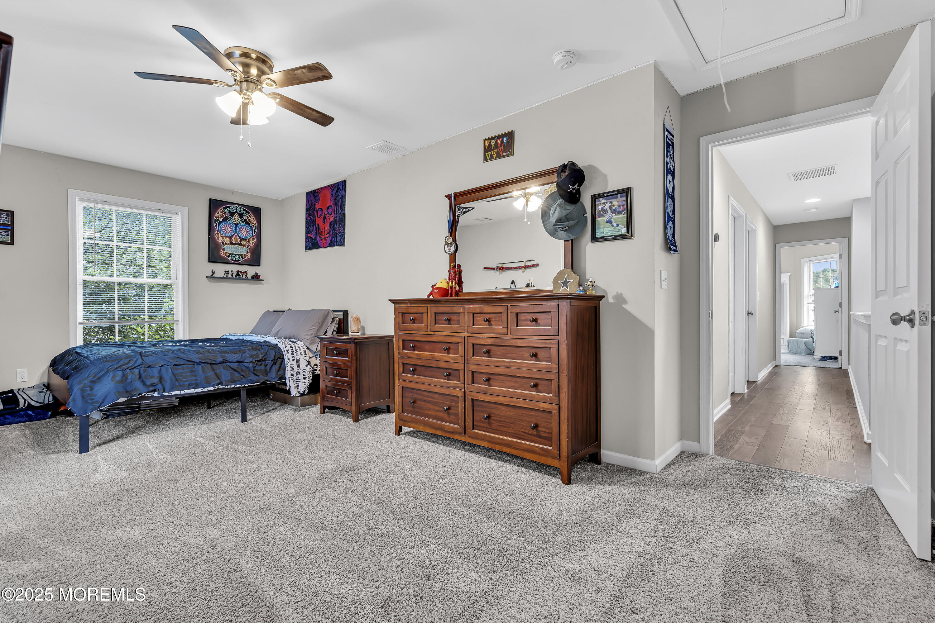 167 Captain Road Manahawkin, NJ 08050 - Photo 60 of 86 a spacious bedroom with a bed and a chandelier