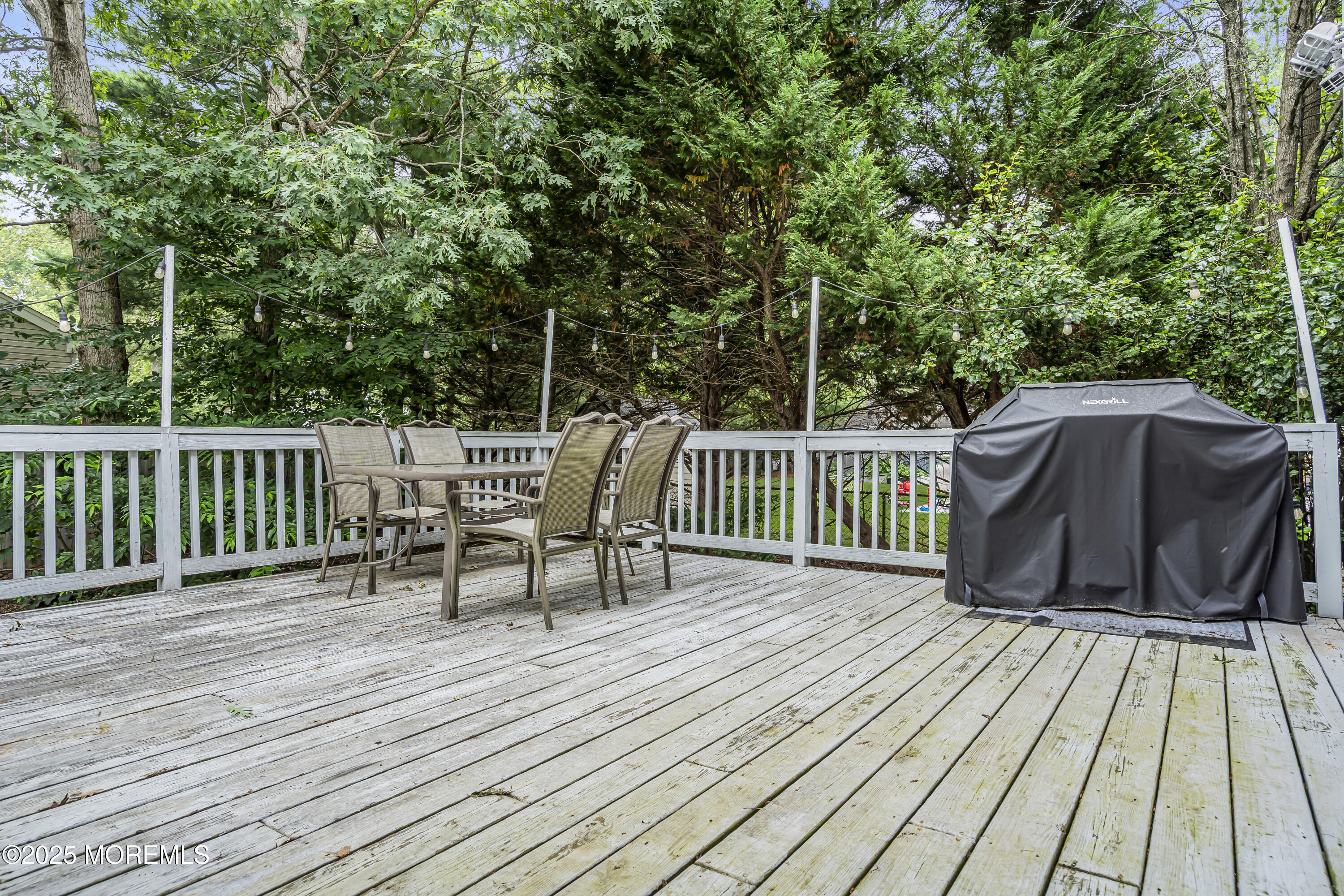 167 Captain Road Manahawkin, NJ 08050 - Photo 71 of 86 a view of a deck with wooden floor and outdoor seating