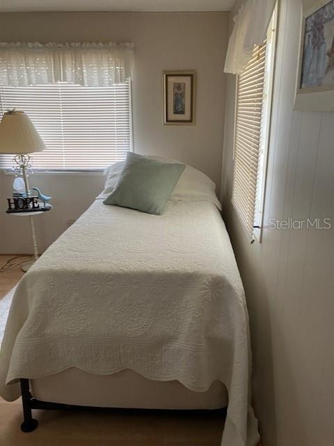 3405 Lanark Drive Holiday, FL 34690 - Photo 18 of 32 a bed sitting in a bedroom next to a window