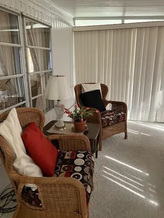 a livingroom with furniture and window