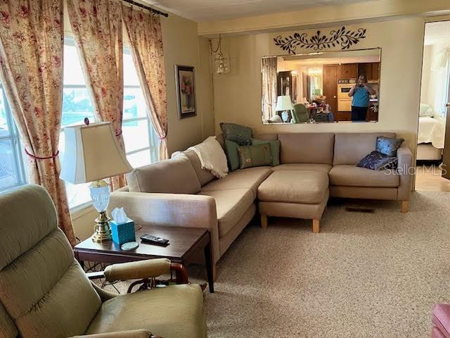3405 Lanark Drive Holiday, FL 34690 - Photo 2 of 32 a living room with furniture and a large window