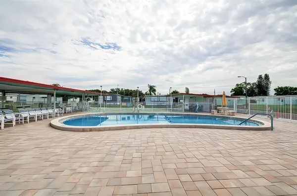 a view of swimming pool with outdoor seating
