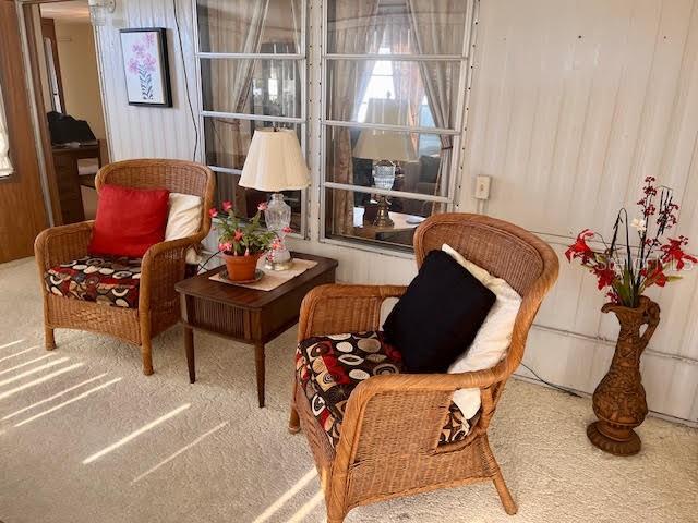 3405 Lanark Drive Holiday, FL 34690 - Photo 3 of 32 a living room with furniture a lamp and a potted plant
