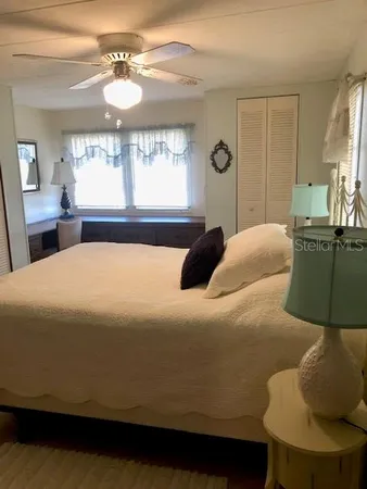 a bedroom with a bed and window