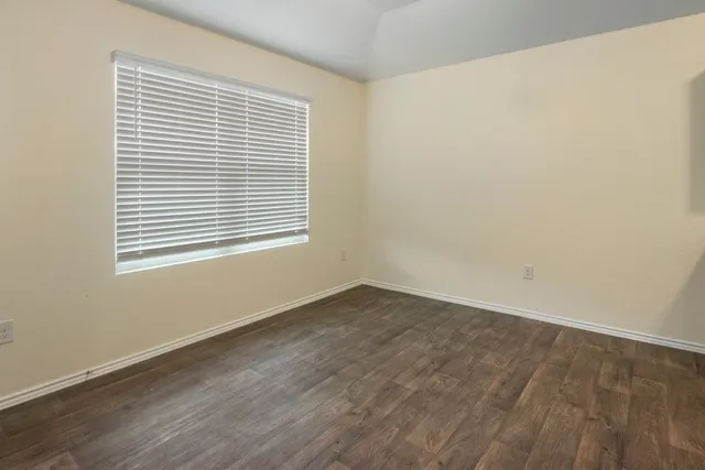 a large white kitchen with a refrigerator a stove top oven a sink and dishwasher