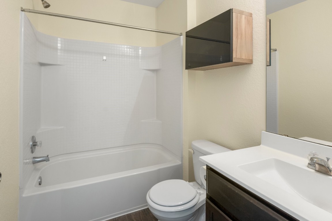 3600 Batson Drive Austin, TX 78725 - Photo 21 of 33 a bathroom with a sink a toilet and shower