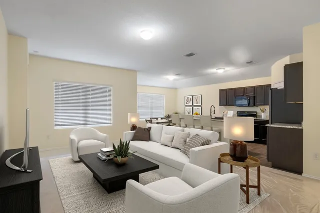 a view of a dining room with furniture and window