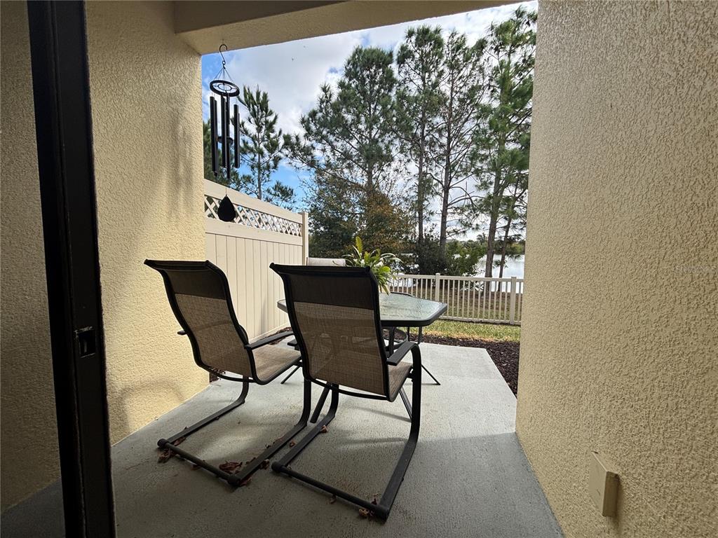 9136 Fox Sparrow Road Tampa, FL 33626 - Photo 16 of 34 a view of a dining room with furniture and wooden floor
