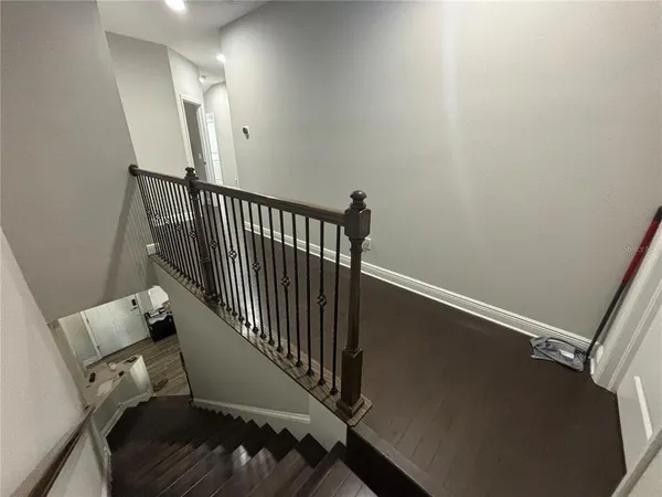 a view of a hallway with staircase