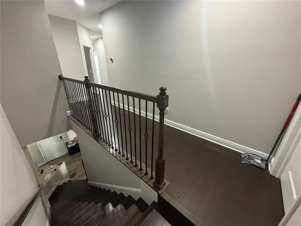 9136 Fox Sparrow Road Tampa, FL 33626 - Photo 17 of 34 a view of a hallway with staircase