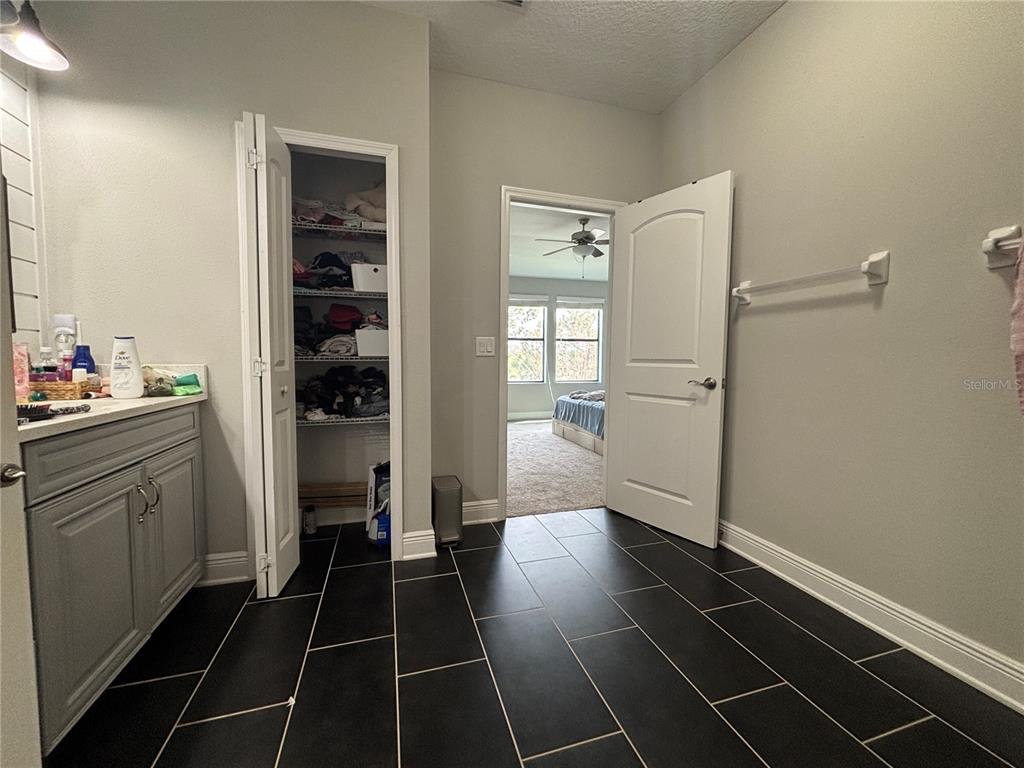 9136 Fox Sparrow Road Tampa, FL 33626 - Photo 21 of 34 a bathroom with a sink and a shower