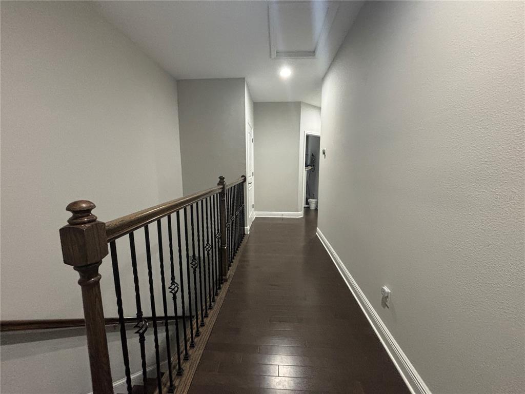 9136 Fox Sparrow Road Tampa, FL 33626 - Photo 22 of 34 a view of a hallway with wooden floor
