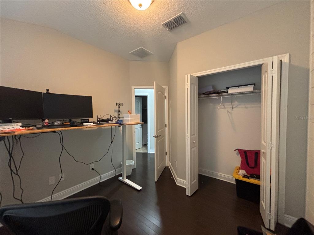 9136 Fox Sparrow Road Tampa, FL 33626 - Photo 24 of 34 a room with gym equipment and wooden floor