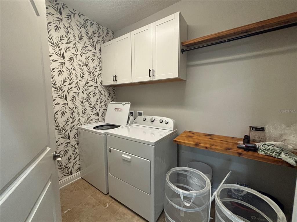 9136 Fox Sparrow Road Tampa, FL 33626 - Photo 25 of 34 a utility room with dryer and washer