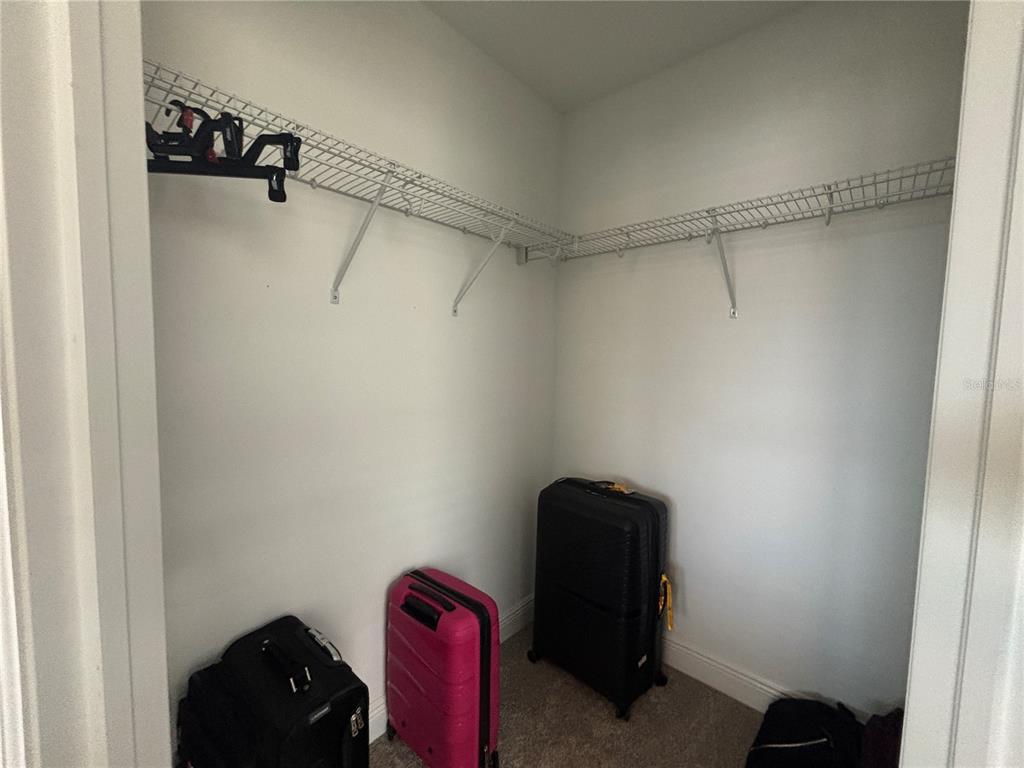 9136 Fox Sparrow Road Tampa, FL 33626 - Photo 31 of 34 a view of a closet in a room