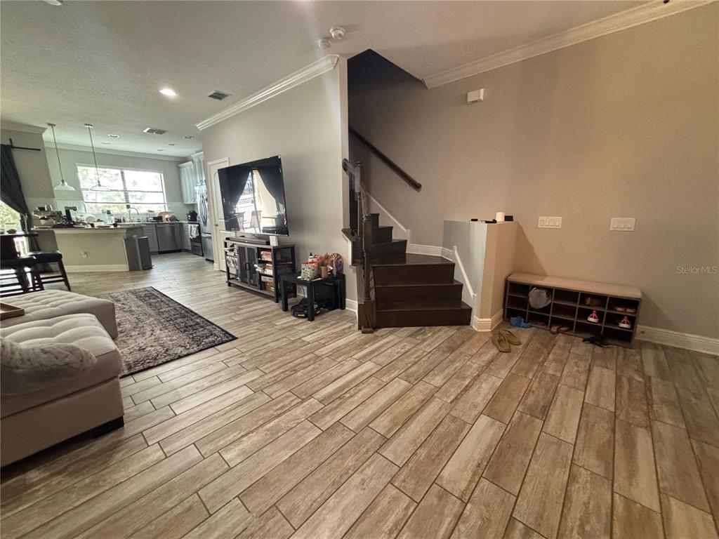 9136 Fox Sparrow Road Tampa, FL 33626 - Photo 5 of 34 a living room with furniture and a wooden floor