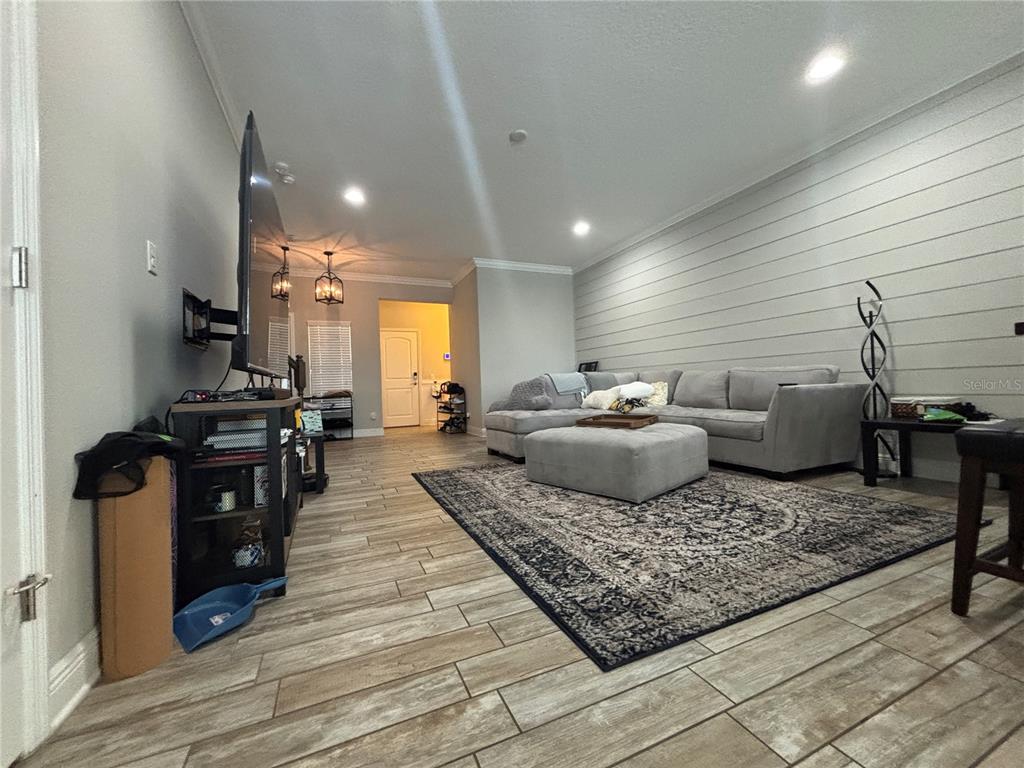 9136 Fox Sparrow Road Tampa, FL 33626 - Photo 10 of 34 a living room with furniture and wooden floor