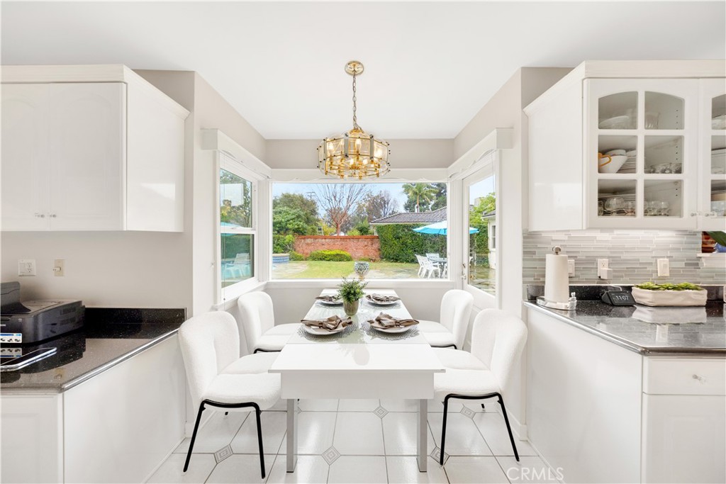 2835 Devonport Road San Marino, CA 91108 - Photo 19 of 54 a dining room with furniture a chandelier and window