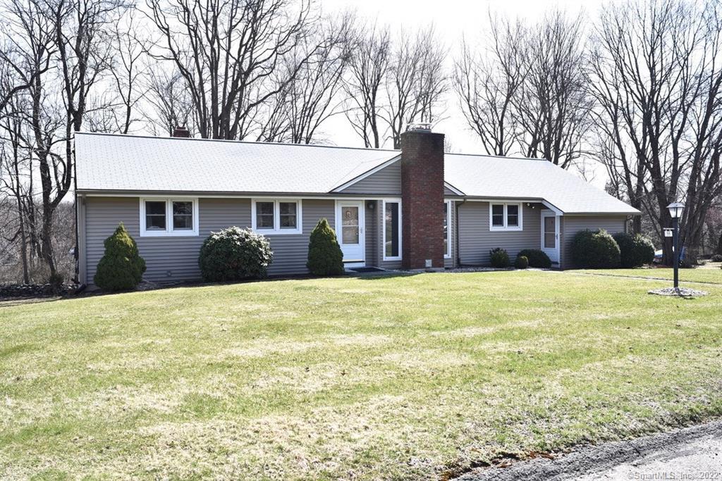 55 Ascolese Road Trumbull, CT 06611 - Photo 1 of 1 a front view of house with yard and green space