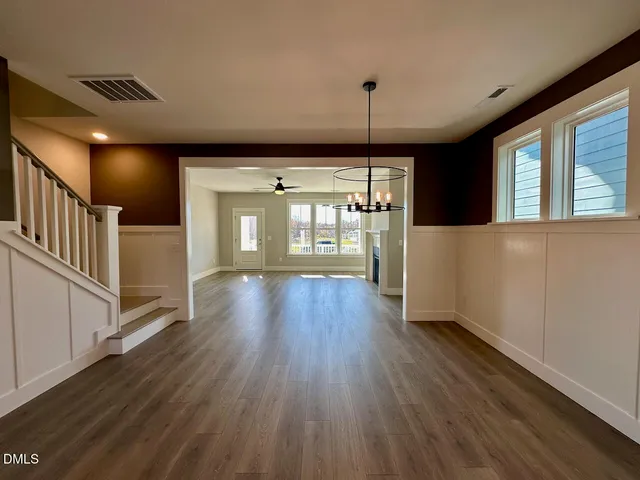 a kitchen with kitchen island a sink appliances and cabinets
