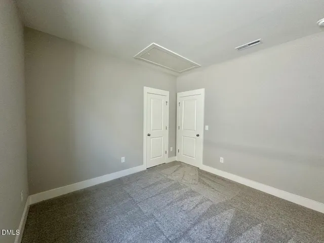 a bathroom with a sink mirror vanity and toilet
