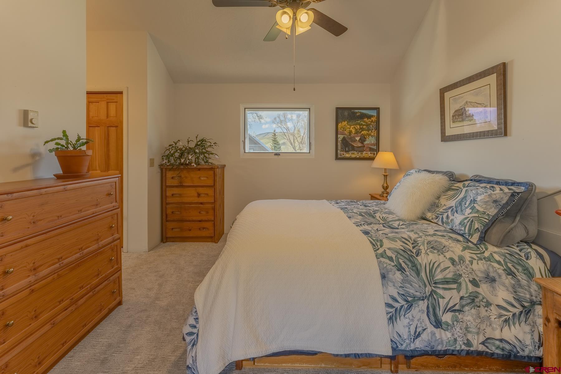 310 2nd Street Crested Butte, CO 81224 - Photo 21 of 42 a bedroom with a bed and a dresser