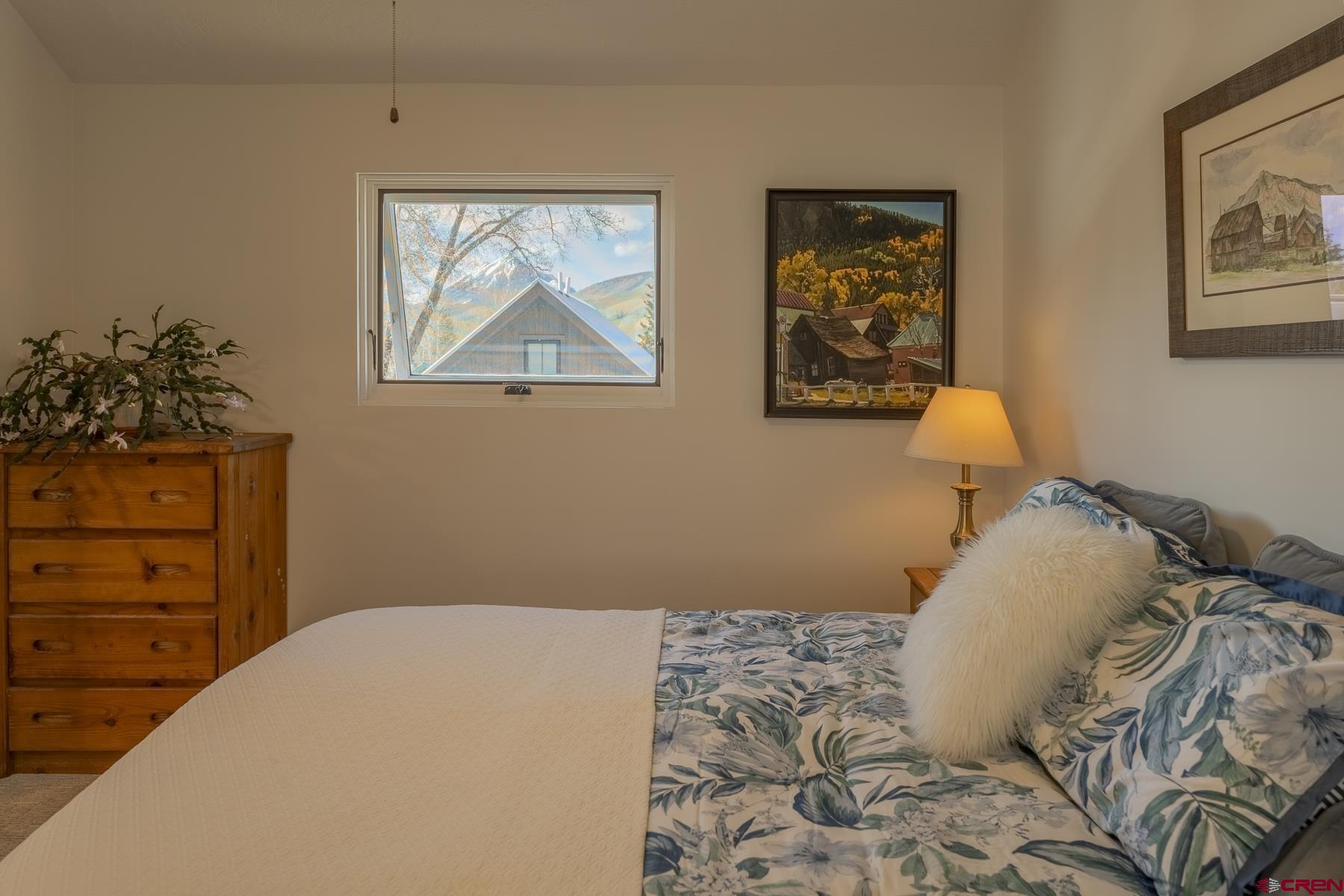 310 2nd Street Crested Butte, CO 81224 - Photo 22 of 42 a bedroom with a bed and a window