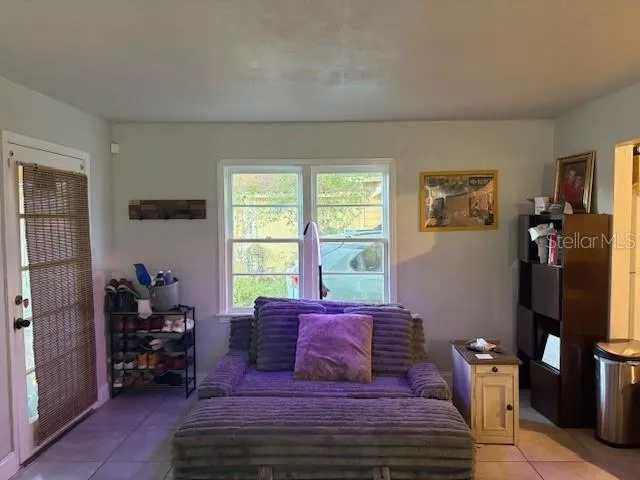 a bed room with furniture and a window