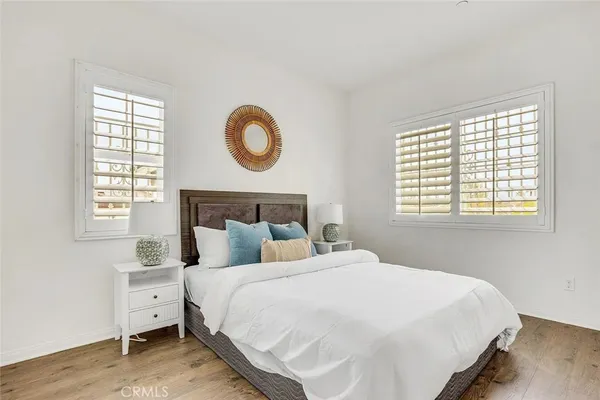 a bedroom with bed and a window