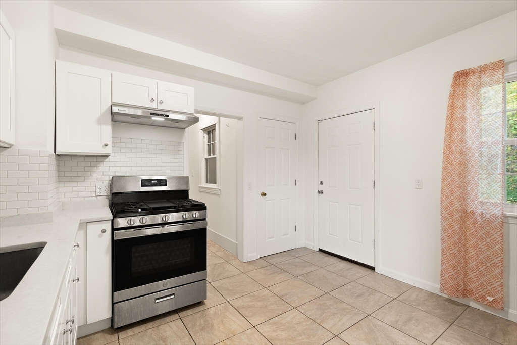 10 Minthorne Street Worcester, MA 01603 - Photo 15 of 29 a kitchen with a stove and a sink