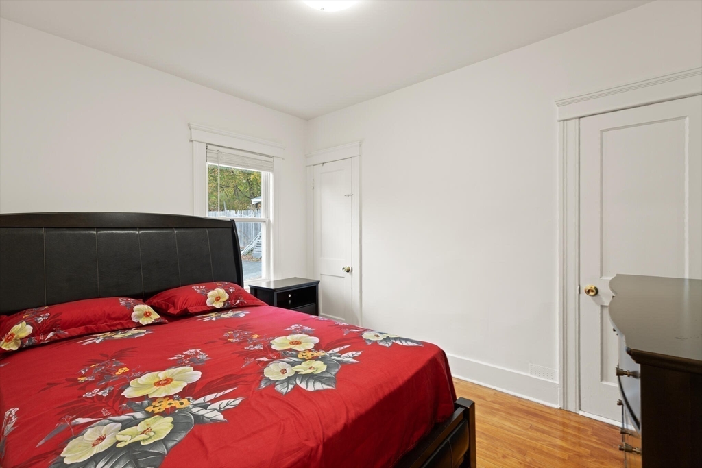 10 Minthorne Street Worcester, MA 01603 - Photo 21 of 29 a bedroom with a bed and wooden floor
