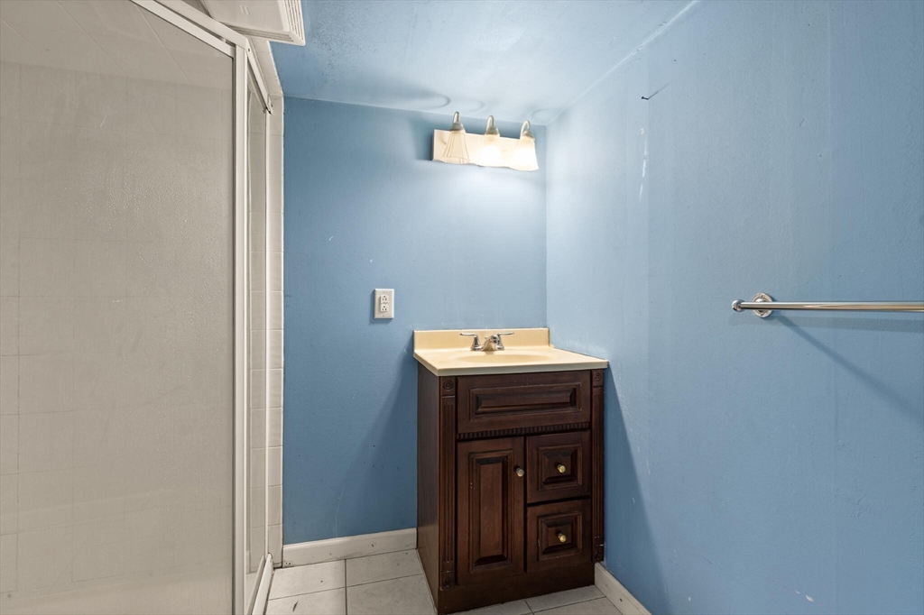 10 Minthorne Street Worcester, MA 01603 - Photo 26 of 29 a bathroom with a sink and vanity