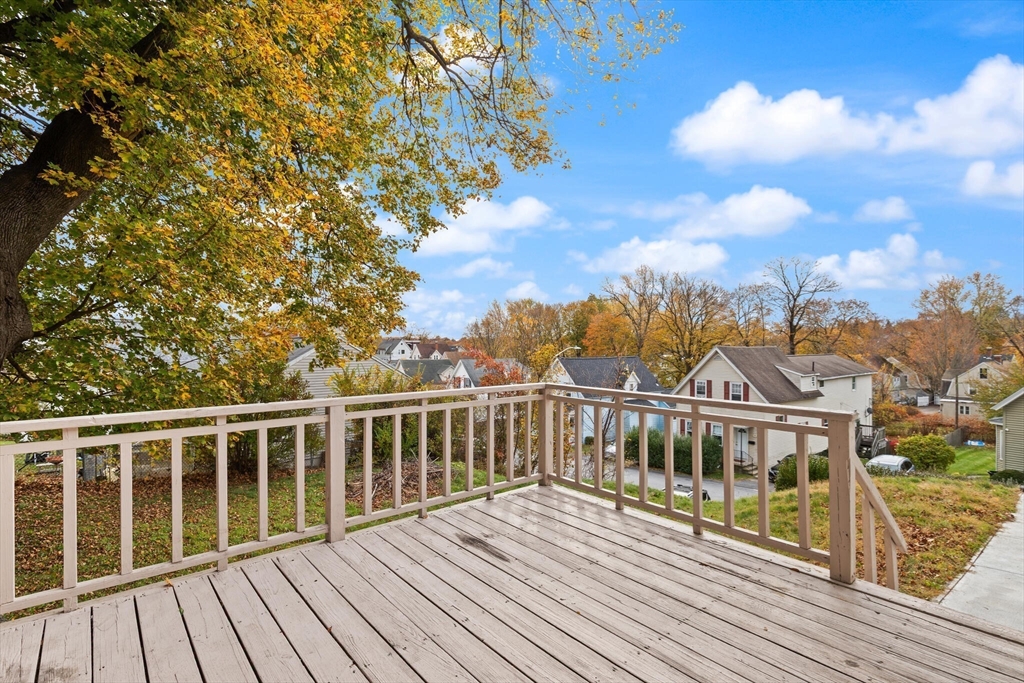 10 Minthorne Street Worcester, MA 01603 - Photo 5 of 29 a view of a balcony with wooden floor and city view