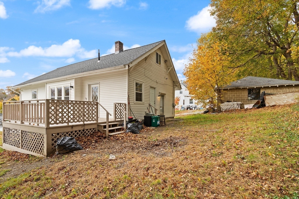 10 Minthorne Street Worcester, MA 01603 - Photo 6 of 29 a backyard of a house with table and chairs