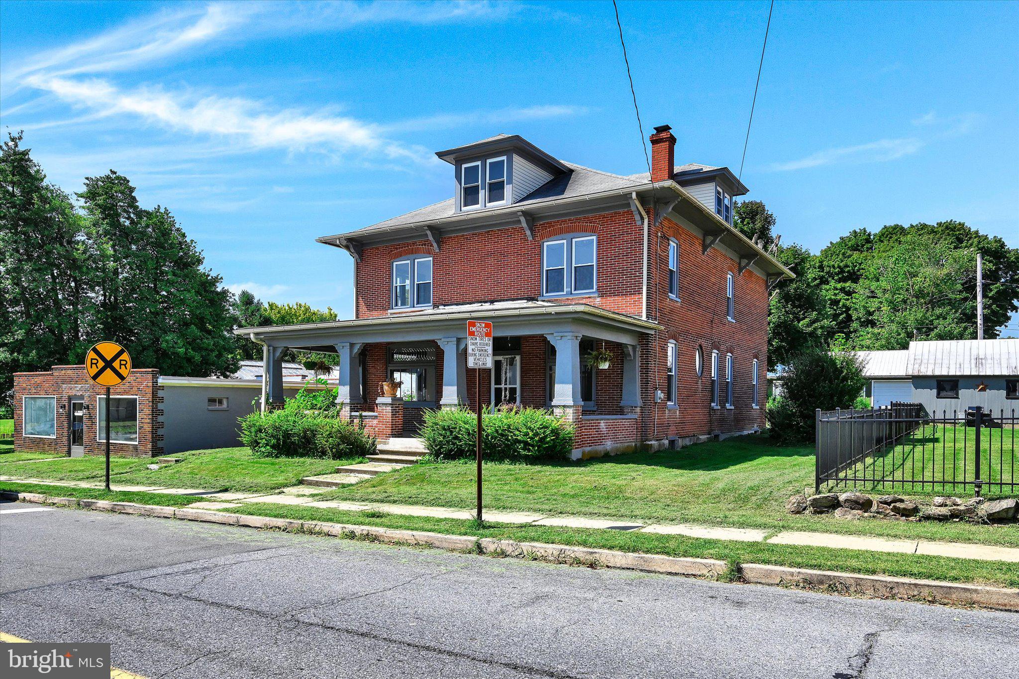 32 North Main Street Topton, PA 19562 - Photo 2 of 36 a front view of a house with a yard and potted plants